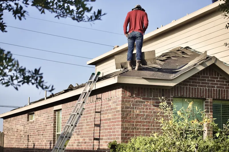 Professional roofer working on a residential roof in Old Dayton